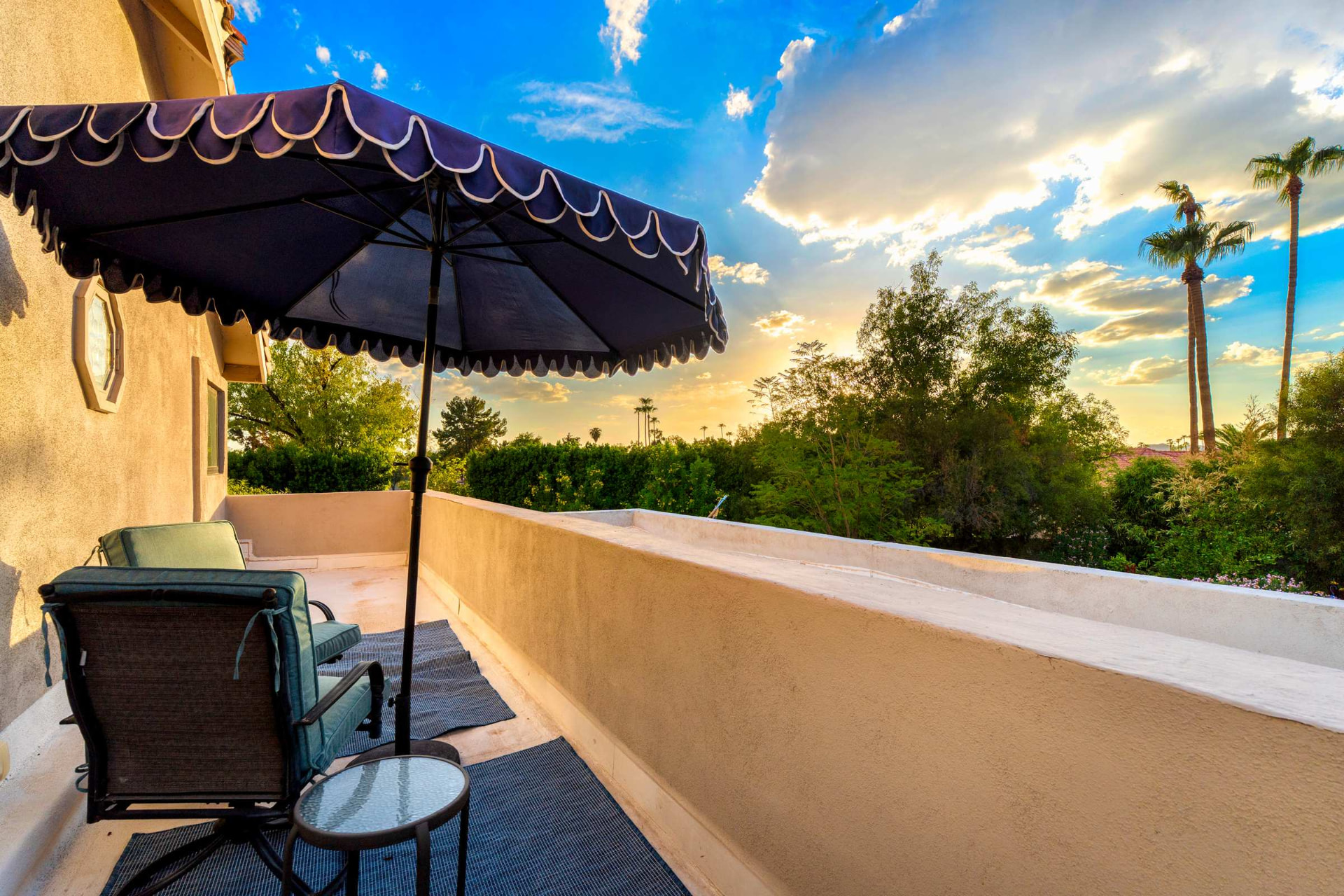 Private balcony at sunset above the grounds