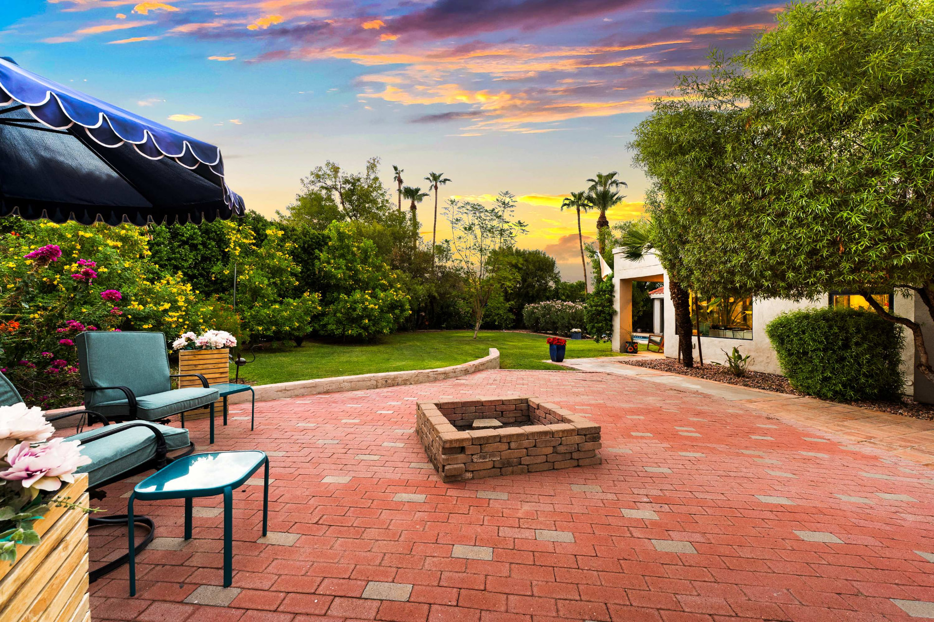 Brick terrace and fire pit at sunset