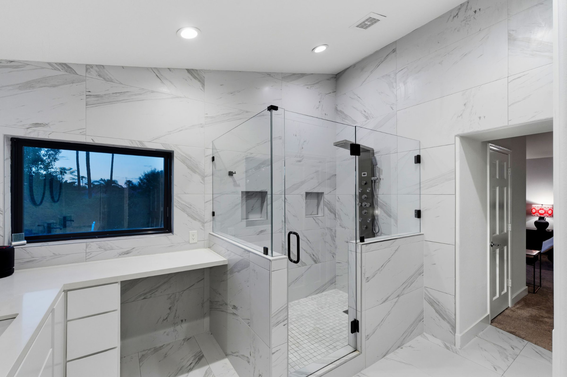 Primary bath in book-matched marble tile